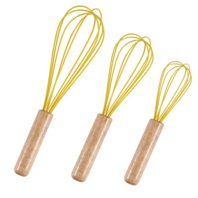 China Egg Beater Cream Stirrer Kitchen Egg Mixer Tools Silicone Stocked Cooking Eggbeater with Wooden Handle for sale