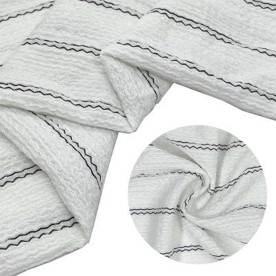 China New Hot Selling Black 100% Polyester Stripe Crepe Fabric Anti-static Warp Knitted Fashion White Fabric For Dress for sale