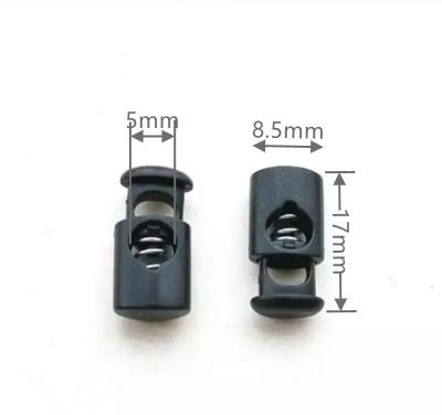 China Custom Good Quality Black Spring Adjustable Plastic Cord Nickel Free Rope End Stopper Toggle Lock for sale