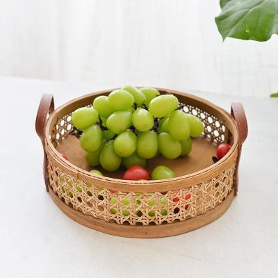 China Sustainable Vintage Rattan Tray Handmade Leather Handles Storage Basket Rattan Picnic Basket Perfume Aroma Dish for sale