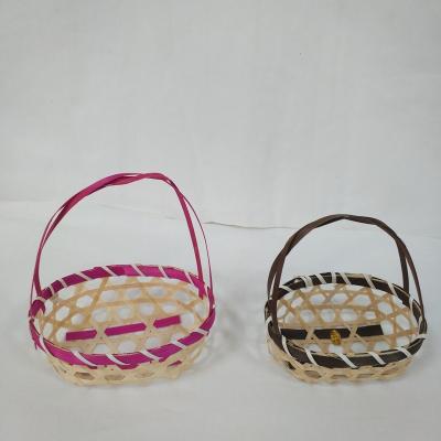 China Sustainable hand - woven mini basket around storage festival basket gift bamboo basket is colorful egg bamboo for sale