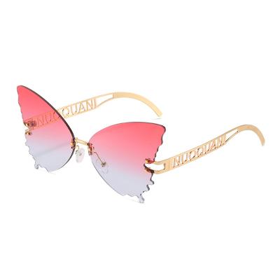 China 2021 Customizable Anti Color UV400 Ladies Rimless Glass Sunglasses Luxury Butterfly Shaped Sun Glasses for sale