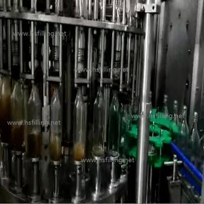 China CE de acero inoxidable de la máquina de la botella que capsula de cristal de la bebida alcohólica del relleno en caliente del casquillo automático de la máquina ROPP en venta