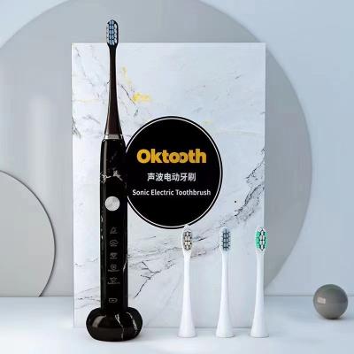 China IPX7 Hotel Office Travel OEM Adult ROHS White Black Feature Waterproof Electric Toothbrush Travel Home Rechargeable Toothbrushes for sale