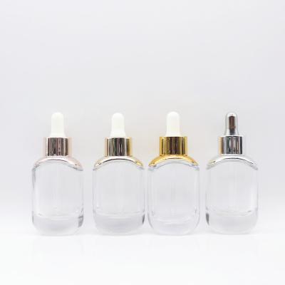 China 30ml Cosmetic Empty Clear Facial Serum Foundation Bottle Dropper Bottle With Gold Silver Dropper Cap for sale