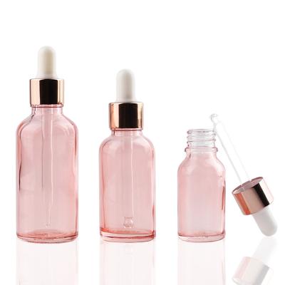 China 1oz 30ml Round 15ml Luxury Skin Care Cosmetic Hair Packaging Essential Oil Cosmetic Serum Rose Gold Glass Pink Dropper Bottle for sale