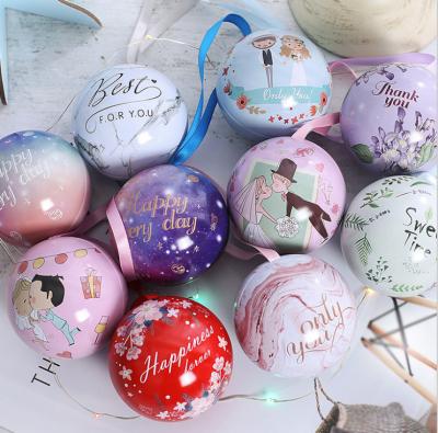 China Recyclable Christmas Decorations Ornaments Open Gift Tree Ball Tin Box Chocolate Candy Cookie Christmas Tin Ball With Ribbon for sale