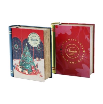 China Custom Packaging 2021 New Design Christmas Gift Tin Book Shaped Empty Metal Food Grade Book Tea Tins Box for sale