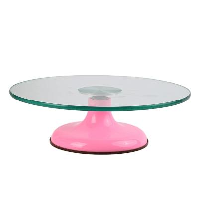 China Viable Wholesale Custom Made Pink Tempered Glass Pedestal Rotating Round Cake Tower Decorating Table for sale