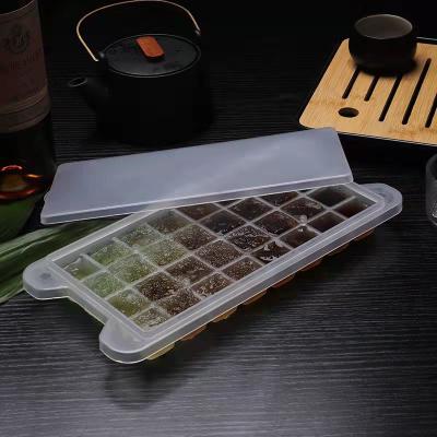 China Sustainable Hot Sale Silicone Ice Cube Tray Easy-Release Silicone 32-Ice Cube Trays With Spill-Resistant Removable Lid for sale