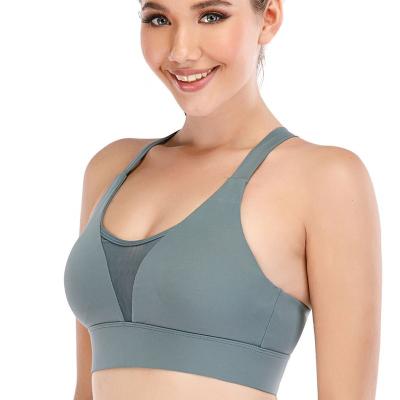 China Breathable high quality loose sports bra yoga women cross 2021 cup bras set backless top made in china for sale