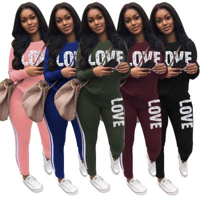 China New Casual Anti-wrinkle Lady 2 PCs Letter Print T-shirt and Tight Pants Plus Size Women Two Piece Set for sale