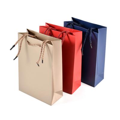 China Recyclable Custom Gold Gift Packaging Kraft Paper Bag Manufacturer For Shopping for sale