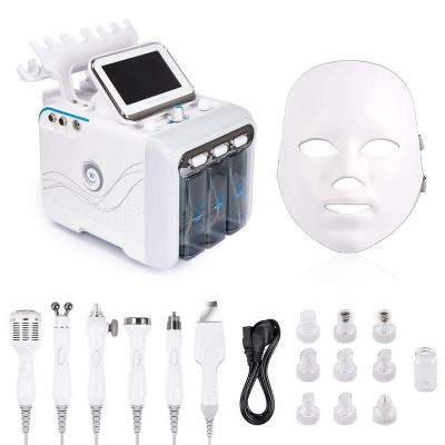 China Tanning Low Price 7 In 1 Hydraulic Facial Care Skin Tightening Beauty Machine Facial Massager for sale