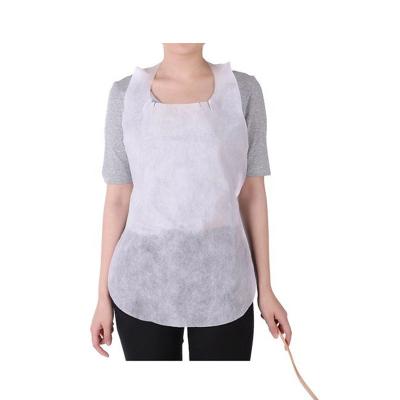 China OEM Cheap Wholesale Disposable Sleeveless Aprons Paper Waterproof Nonwoven Fabric Apron for sale