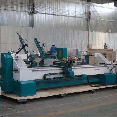 China Hotels 4 Axis Automatic Feeding Wood Lathe Machine CNC Wood Revolving Milling Lathe for Curved Table and Chair Legs for sale