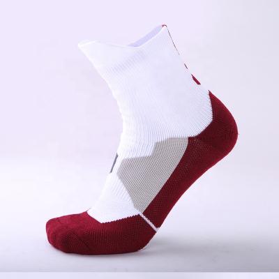 China Anti Slip Stock Spell Socks Soccer Team Wear Grip Basketball Socks for sale