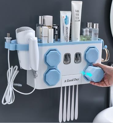 China Amazon Viable Automatic Toothpaste Rack Holder Hair Dryer Holders and Racks Toothpaste Dispenser Bathroom Storage Holders for sale