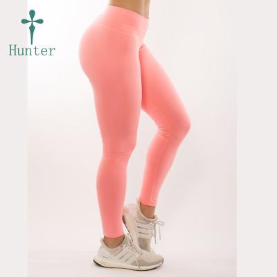 China Antibacterial Yoga Pants Compression UV Dry Orange Yoga Build Up Fit Pants for sale