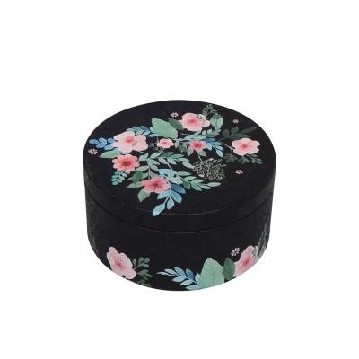 China Recyclable Custom Black Round Tin Box Metal Tea Container Packaging With Slip Cover for sale