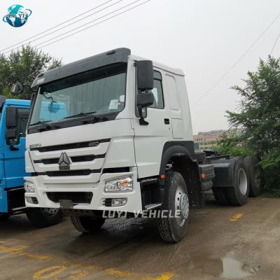 China China 10 wheeler sinotruk howo 7 trailer truck 6x4 head 420 tractor truck brand new price 6800X2500X3000 for sale