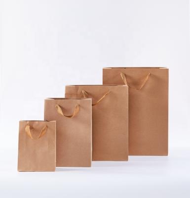 China Recyclable Most Welcomed Logo Parrtn Brown Kraft Paper Paper Shopping Bag Custom Gift Bag With Handle for sale