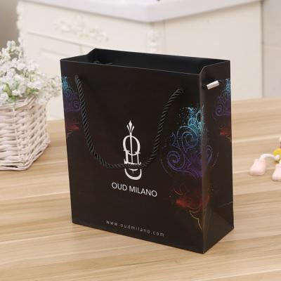 China Recyclable Black Paper Bag Shopping Bag Rope Handle Packaging Paper Bags With Your Own Logo for sale