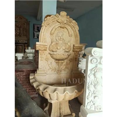 China Modern popular factory supplied Europe style outdoor antique stone figurine wall fountain for outdoor decoration for sale