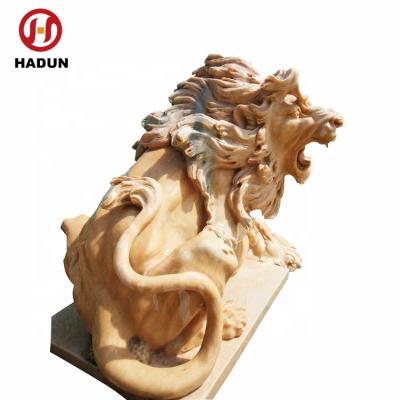 China Eco-friendly Sunset Red Marble Sitting Fierce Lion Statue for sale