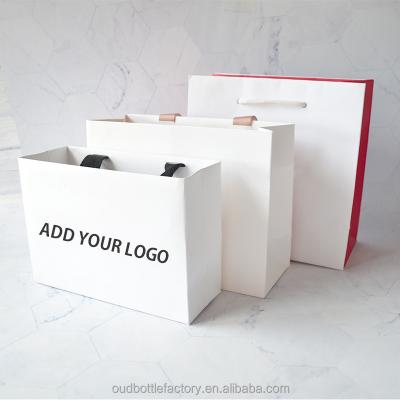 China Printed Cardboard Paper Bag Recyclable White Shopping Bag With Logo Creative Gift Packaging Bag for sale