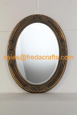 China Antique gold finish PU framed oval shaped wall mirror with carved flowers and bevelled mirror for sale