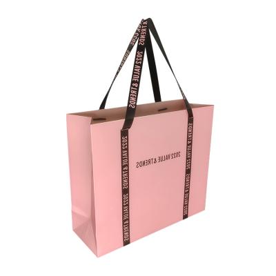 China Recyclable Recycled Custom Paper Packaging Bag For Clothing With Own Logo Ribbon Handles for sale