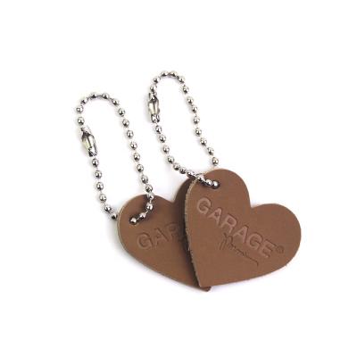 China Custom heart shaped leather patch workable with branding with chain for garment for sale