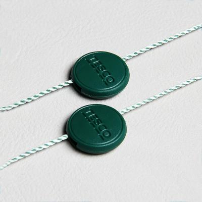 China Sustainable Custom Debossed Plastic Hang Tags Seal Watch Tag With Nylon String for sale