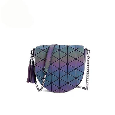 China 2021 Fashion Casual Saddle Bag Ladies Shoulder Bag Geometric Luminous Laser Reflective Female Bag With Tassel for sale