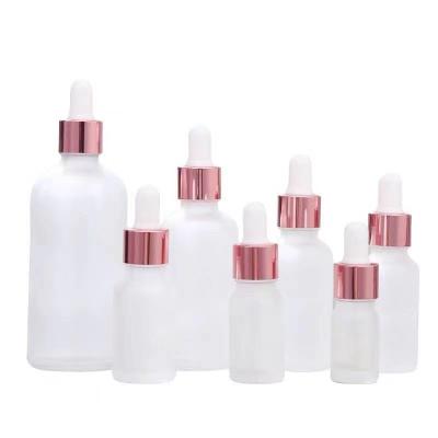 China Cosmetic 5ml 10ml 15ml 20ml 30ml 50ml 100ml Frosted Rose Gold Luxury Glass Dropper Essential Oil Bottle For Serum for sale