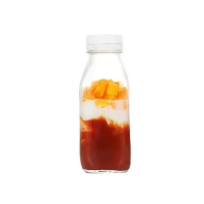 China Hot Sales Square Beverage 300ml 500ml 1000ml Empty Glass Juice Bottle For Milk With Tamper Proof Cap for sale