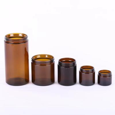 China Home Decoration 8oz 16oz Empty Round Shaped Amber Glass Jars For Making Candles for sale