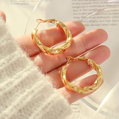 China TRENDY Fashion temperament women twist design stainless steel gold plated hoop earrings for sale