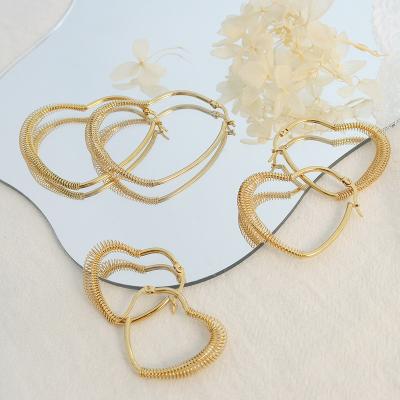 China TRENDY Unique niche heart shaped spring decorative stainless steel gold plated ring earrings for sale