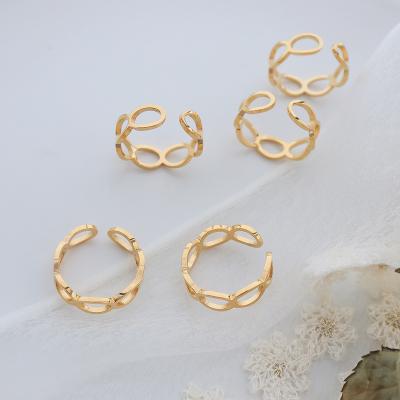 China Trendy Fashion Design Women Eternity Cool Stainless Steel Indelible Gold Plated Oval Hollow Dome Ring for sale