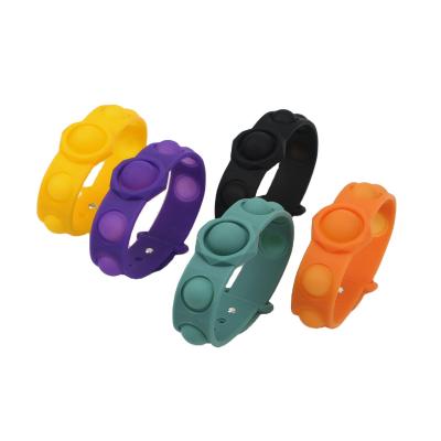 China Little kids jumping up sensory toys coloful fidgety person fidgety person push noise silicone wristband for sale