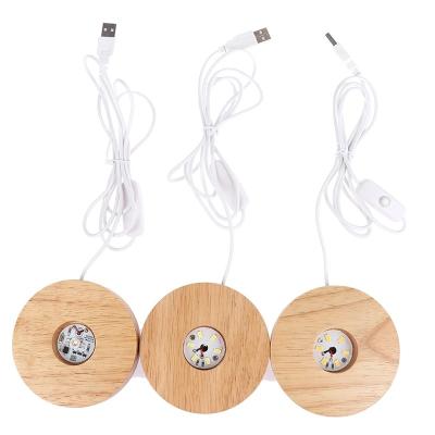 China Modern Wooden Base LED Light Rechargeable Remote Control Wooden Light Holder Lamp Rotating Base Art Ornament for sale