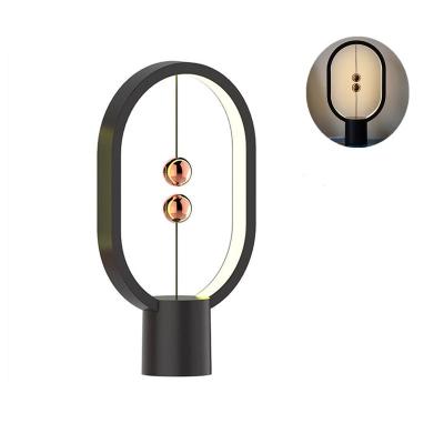 China Modern Creative Night Light LED Ellipse Midnight Balance Magnetic Switch Lamp Touch Dimming Home Decor for sale