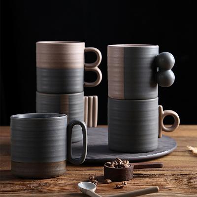 China Viable Creative Design Gift Japanese Style Two Tone Stoneware Cappuccino Latte Tea Cups Ceramic Coffee Mug With Special Shaped Handle for sale