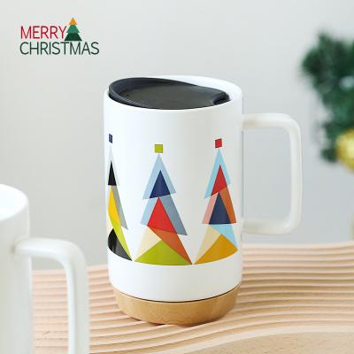 China Viable Unique Design Christmas Trees Pattern Bamboo Coaster Coffee Mug Custom Bulk Christmas Ceramic Mug With PP Lid for sale