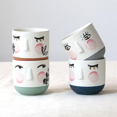 China Viable Wholesale Custom Logo Attractive Artistic Hand Painted Face Tea Cup Set Coffee Ceramic Tea Cup For Gift for sale