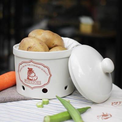 China Sustainable Popular Design Ware Kitchen Tools White Onion Garlic Potato Ceramic Food Storage Jar Canister With Lid for sale