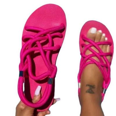 China Anti-odor Summer Solid Lace Up Flat Casual Beach Sandals Women Bandage Women's Sandals 2022 for sale