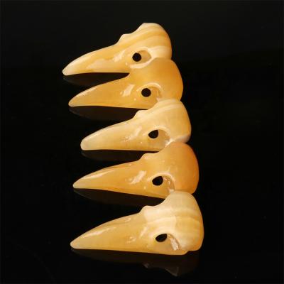 China China Crystal Skulls Jewelry Hand Carved Craft Yellow Jade Carving Skulls Ornament For Home Gift for sale